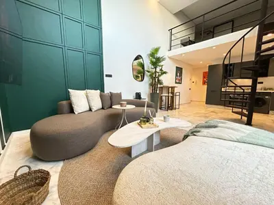 a living room with a couch and a table at Carrington Stay 13 in Casablanca