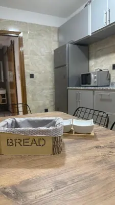 a wooden table with a bread box on top of it at Confort et mer Océan Rabat in Rabat