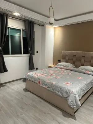 a bedroom with a bed and a window at Confort et mer Océan Rabat in Rabat