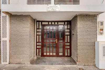 an entrance to a building with a wooden door at Authentic & Spacious 2 Bedrooms Heart of Rabat in Rabat