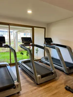 a gym with three treadmills in a room at Luxury Apartment with a Stunning Sea View - Rabat in Rabat