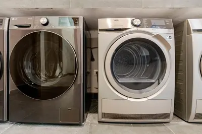 a washing machine and a dryer are next to each other at Appartement Design avec Parking et Salle de Sport Ferme Bretonne in Casablanca