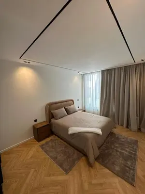 a bedroom with a bed and a large window at Casablanca Maarif in Casablanca