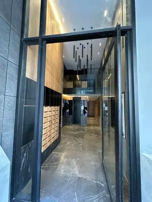 an empty hallway in a building with glass windows at Casablanca Maarif in Casablanca