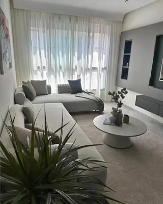 a living room with a couch and a table at A Wonderful Escape In Morocco in Casablanca