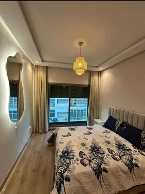 a bedroom with a bed and a large window at A Wonderful Escape In Morocco in Casablanca