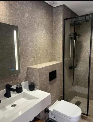 a bathroom with a sink and a toilet and a shower at A Wonderful Escape In Morocco in Casablanca
