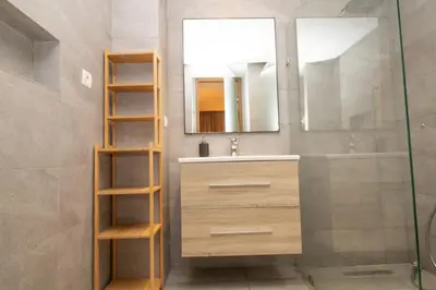 a bathroom with a sink and a mirror at B5 Modern bright studio with city view in Casablanca