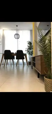 a living room with a table and chairs and a dining room at Studio lumineux et cosy in Casablanca