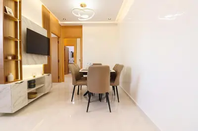 a dining room with a table and chairs at Le Nour- 2 modern bedrooms Luxury and Comfort in Bouznika