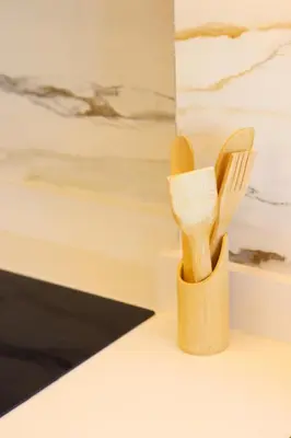 a wooden holder with a fork and a knife at Le Nour- 2 modern bedrooms Luxury and Comfort in Bouznika