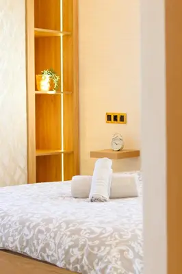 a bedroom with a bed with two towels on it at Le Nour- 2 modern bedrooms Luxury and Comfort in Bouznika