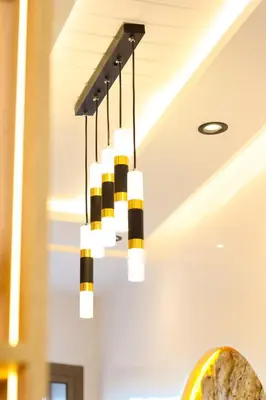 a black and white chandelier hanging from a ceiling at Le Nour- 2 modern bedrooms Luxury and Comfort in Bouznika