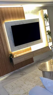 a flat screen tv on a wall in a living room at Appartement neuf vue mer sur la corniche in Rabat