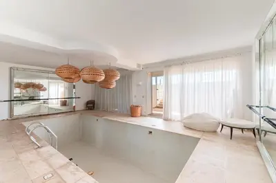 a large bathroom with a tub and a mirror at Cabanon Rêve Bleu terrace and infinite horizon in O Ben Slimane