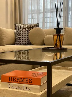 a living room with a couch and a glass table at Studio Chic proche Twins Center in Casablanca