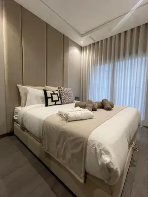 a large white bed in a room with a window at Studio Chic proche Twins Center in Casablanca