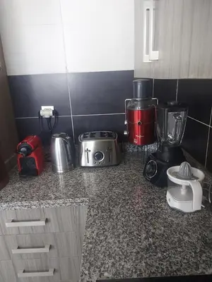 a kitchen counter with various appliances on it at Prestigia Luxurious 3BR 5 min walk from stadium in Rabat