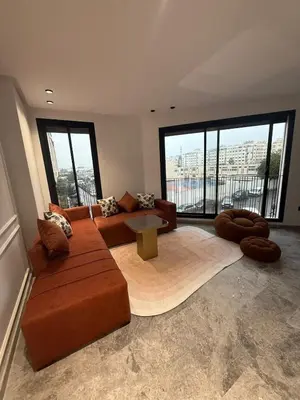 a living room with a couch and a table at 2 bedrooms in the heart of Casablanca in Casablanca