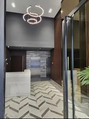 an office lobby with a glass door and a chandelier at 2 bedrooms in the heart of Casablanca in Casablanca