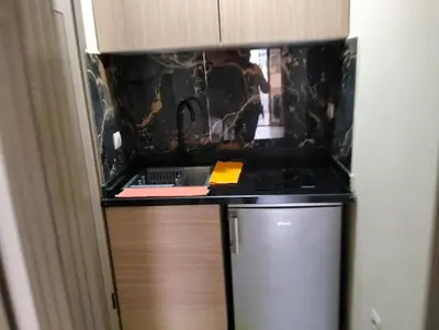 a kitchen with a sink and a counter top at Luxury Apartment Agdal, Ideal for CAN 2025 Fans in Rabat