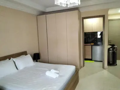 a bedroom with a bed with two towels on it at Luxury Apartment Agdal, Ideal for CAN 2025 Fans in Rabat