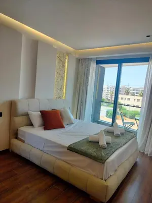 a large bed in a room with a large window at Luxury Stay in Casablanca in Maarif