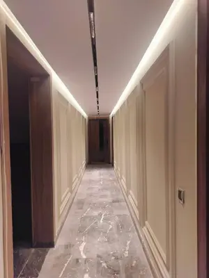 an empty hallway with doors and a hallwayngth at Luxury Stay in Casablanca in Maarif