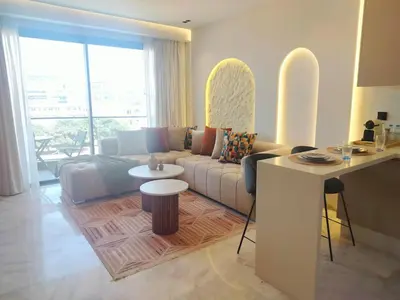a living room with a couch and a table at Luxury Stay in Casablanca in Maarif