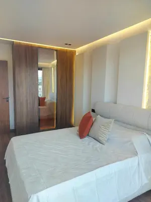 a bedroom with a large white bed with two pillows at Luxury Stay in Casablanca in Maarif