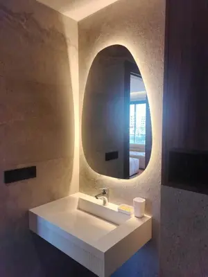 a bathroom with a white sink and a mirror at Luxury Stay in Casablanca in Maarif
