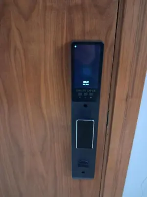 a remote control hanging on a wooden wall at Moderne Studio En plein quartier Maârif avec wifi, balcon,parking et trés bon emplacement in Casablanca