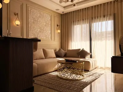 a living room with a couch and a table at Zenata Luxury Stay in Aïn Harrouda