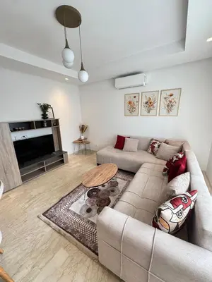 a living room with a couch and a table at VIVASTAY Casablanca - Zenata eco city beach access with swimming pool in Aïn Harrouda
