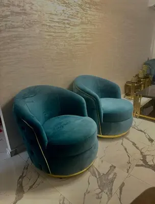 two green chairs and a chair and a table at Najia Blue Pearl in Sidi Rahal