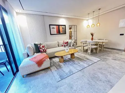 a living room with a couch and a table at Appartement CFC in Casablanca