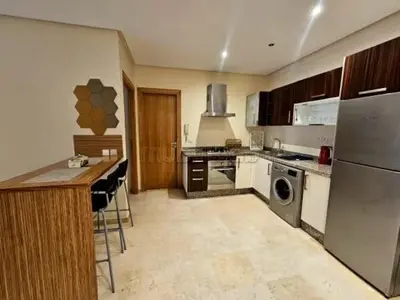 a kitchen with a refrigerator and a dishwasher at A Comfortable Escape In Morocco in Casablanca