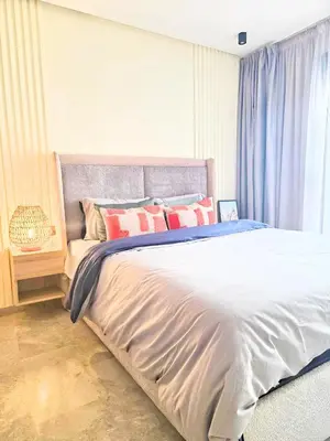 a bedroom with a large white bed with red pillows at Casablanca METROPOL Urban Luxury Loft in Casablanca