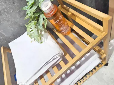 a plant in a bottle sitting on a chair at Casablanca METROPOL Urban Luxury Loft in Casablanca
