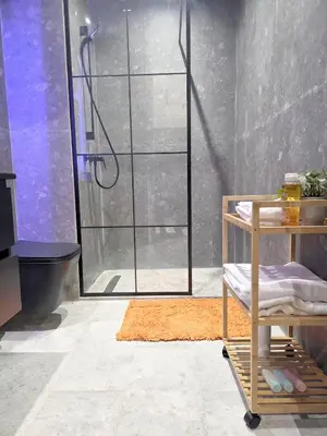 a bathroom with a shower with a glass door at Casablanca METROPOL Urban Luxury Loft in Casablanca