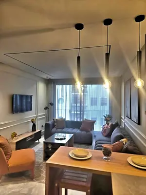 a living room with a couch and a table at Casablanca METROPOL Urban Luxury Loft in Casablanca