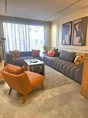 a living room with a couch and a chair at Casablanca METROPOL Urban Luxury Loft in Casablanca