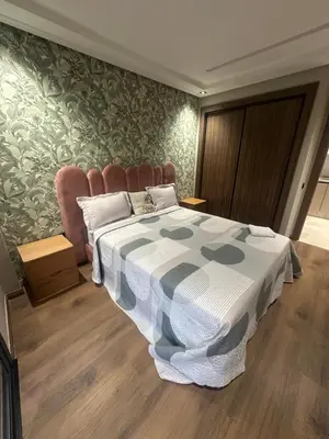 a bedroom with a bed with a blanket on it at Studio Neuf in Casablanca