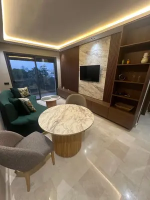a living room with a couch and a table at Studio Neuf in Casablanca