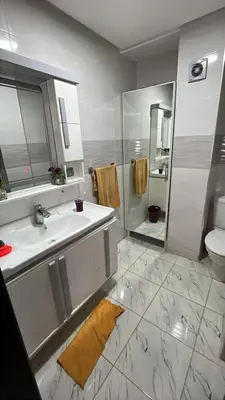 a bathroom with a sink and a toilet at Appartement duplexe convivial in Bouznika