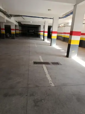 an empty parking lot in an empty parking garage at Appartement duplexe convivial in Bouznika