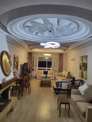 a large living room with a coffered ceiling at Appartement chic de 3 chambres au cœur de Casablanca in Casablanca