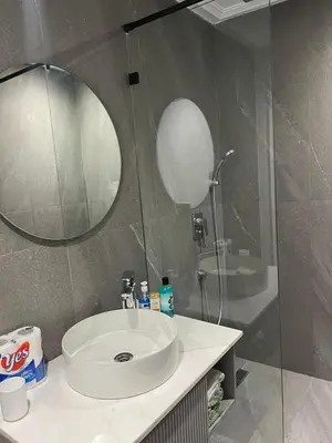 a bathroom with a sink and a mirror at Studio Les princesses in Maarif