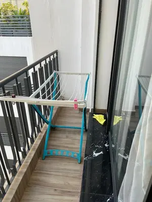 a shopping cart sitting on the side of a balcony at Studio Les princesses in Maarif