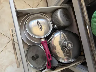 a bunch of pots and pans in a drawer at relaxing apartment in Bouznika in Bouznika